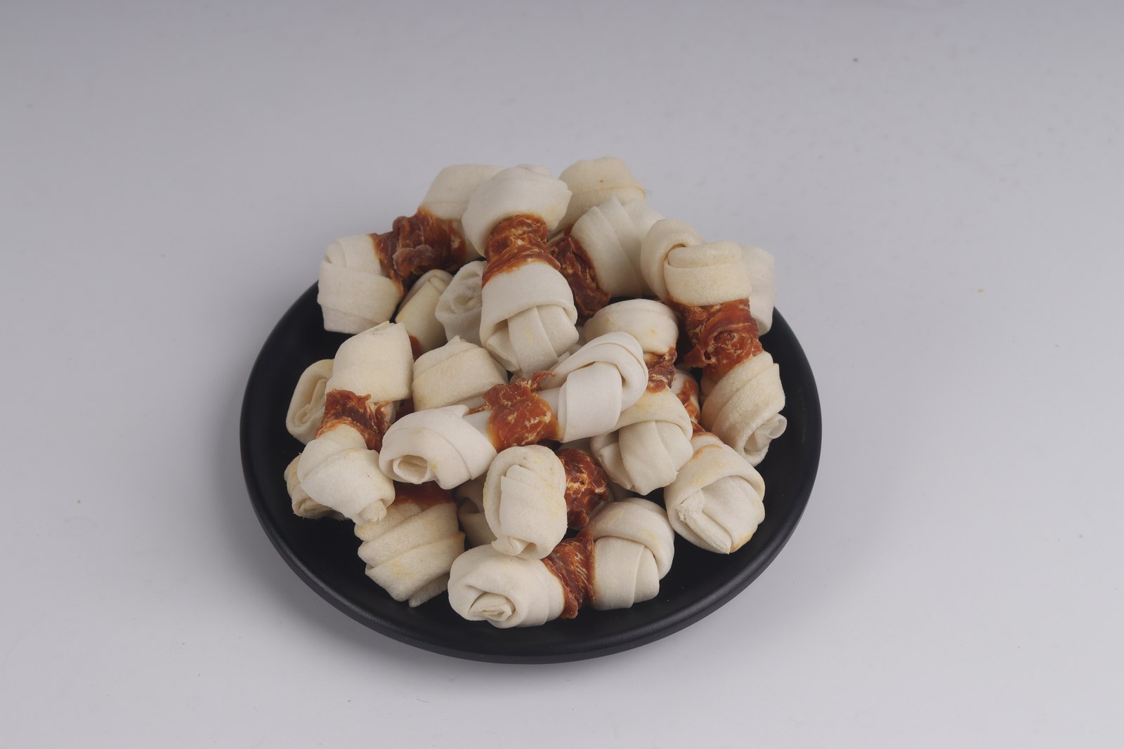 Chicken-wrapped knotted bone