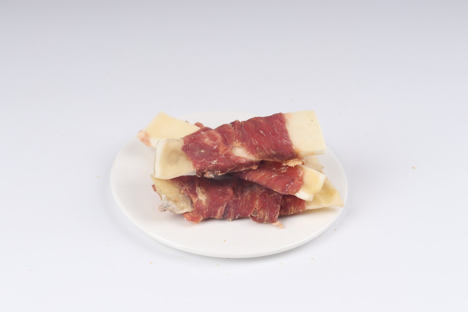 Duck-wrapped bovine rawhide slice