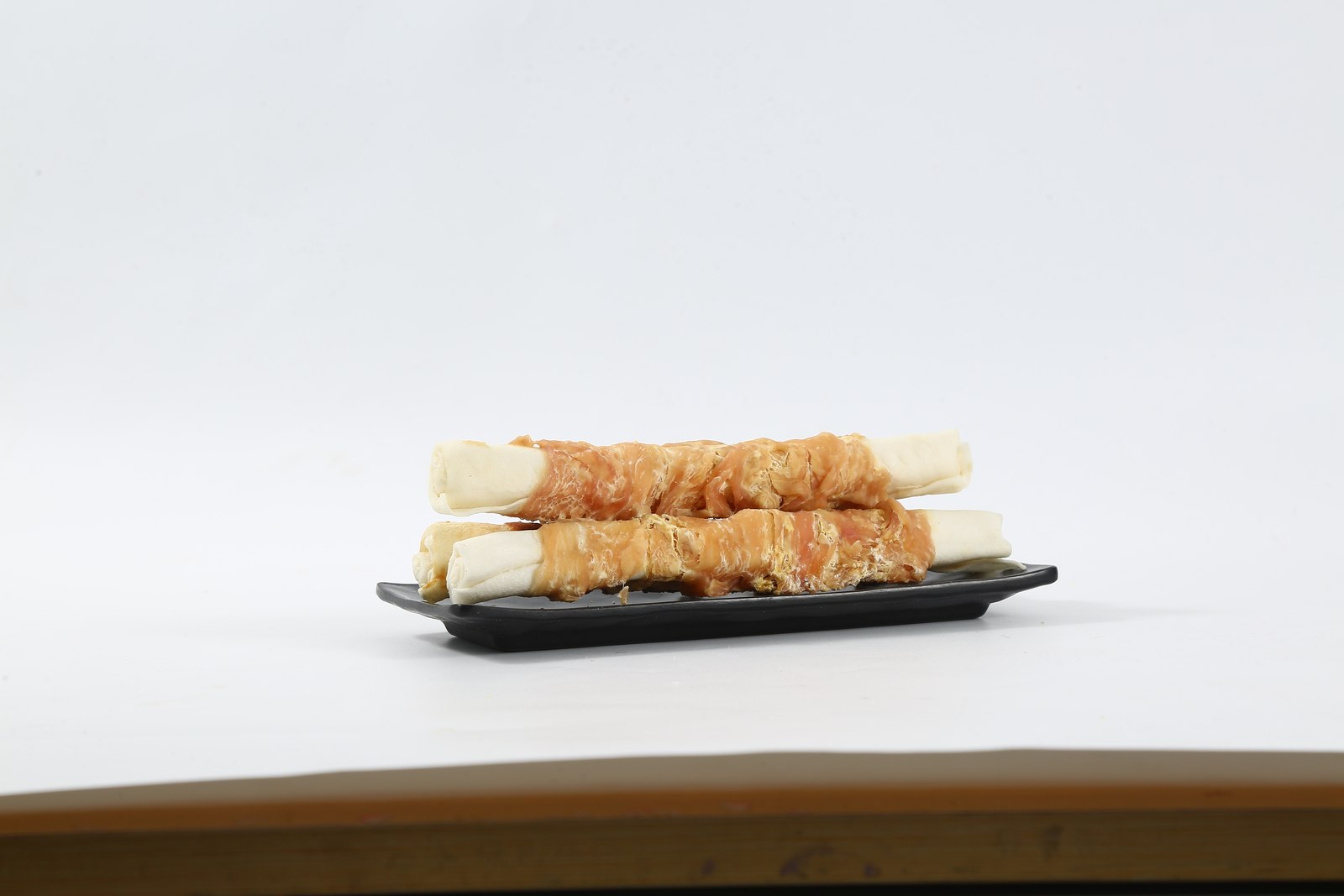 Chicken-wrapped bovine rawhide stick